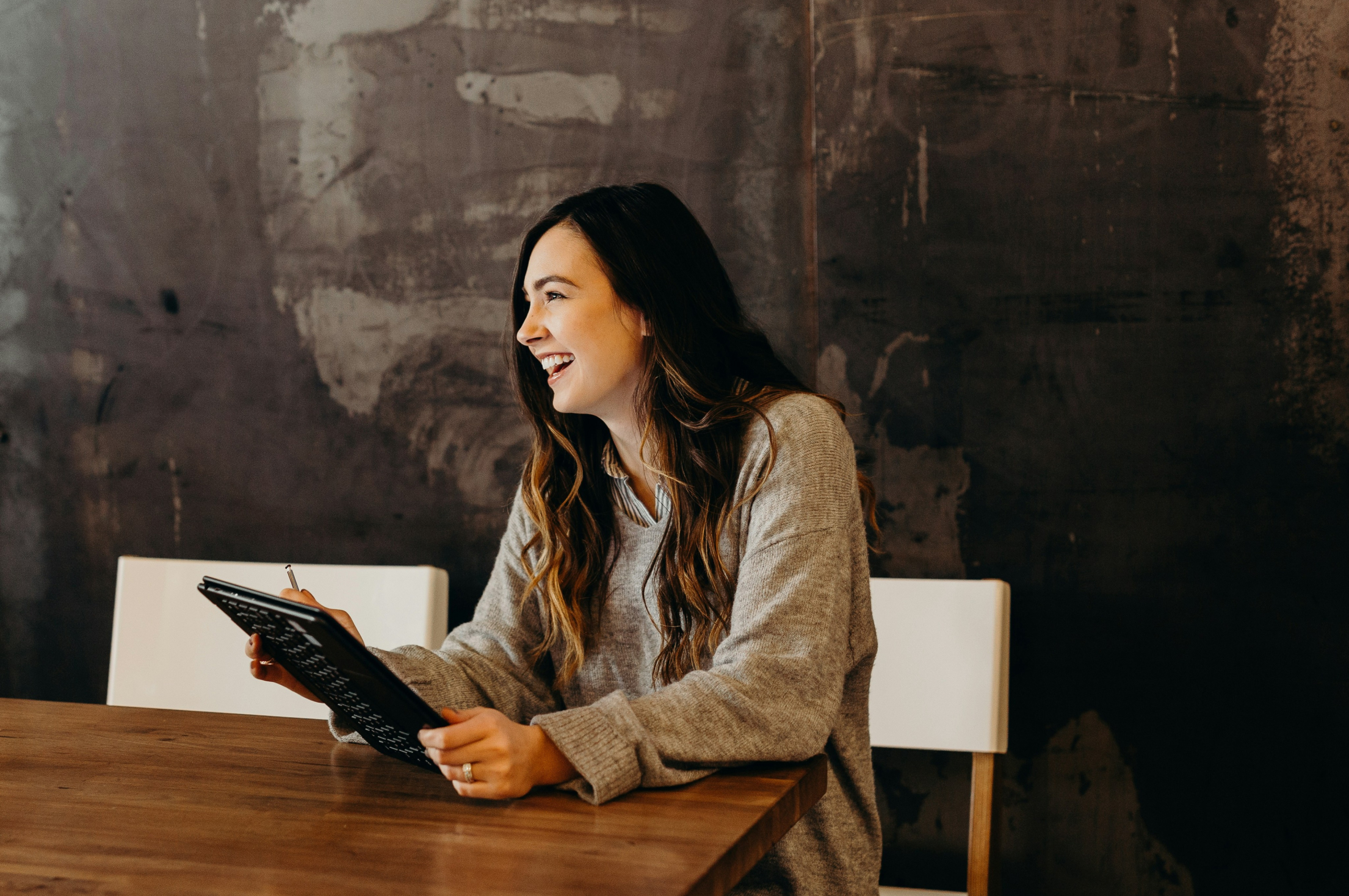 Smiling woman with a tablet computer